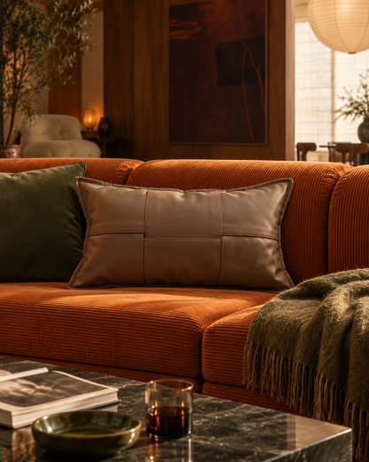MOREL rectangular brown cushion on a rust-coloured sofa in Cosy Autumn